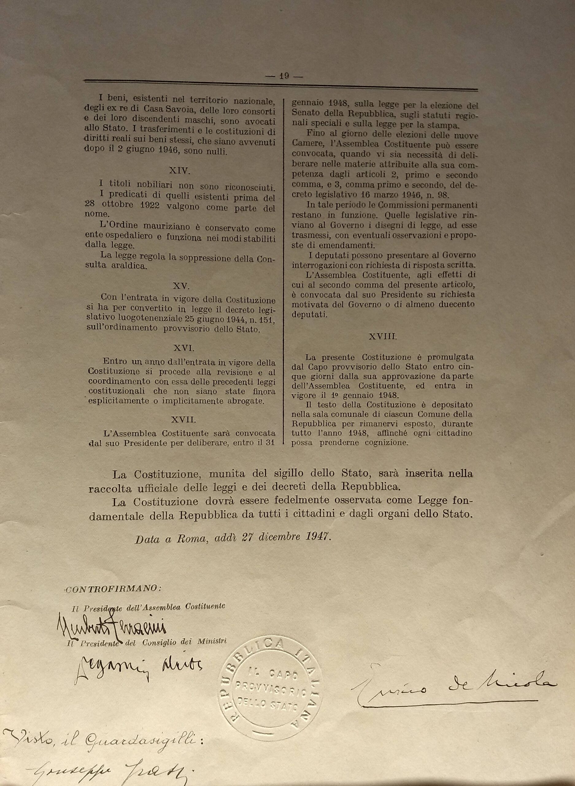 The closing page of the original signed Italian Constitution, dated Rome 27 December 1947, with the seal of the Republic and the signatures of Enrico De Nicola (head of state), Umberto Terracini (President of the Constituent Assembly), Alcide De Gasperi (Prime Minister), and Guardasigilli Giuseppe Grassi.